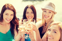 smiling girls with champagne glasses